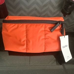 Calpak Luka Belt Bag in orange. NWT.